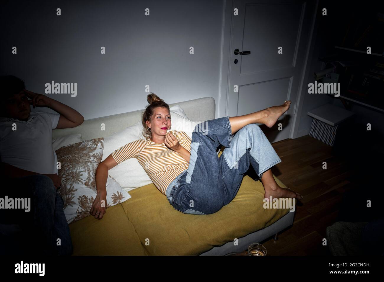 Woman relaxing on sofa Stock Photo