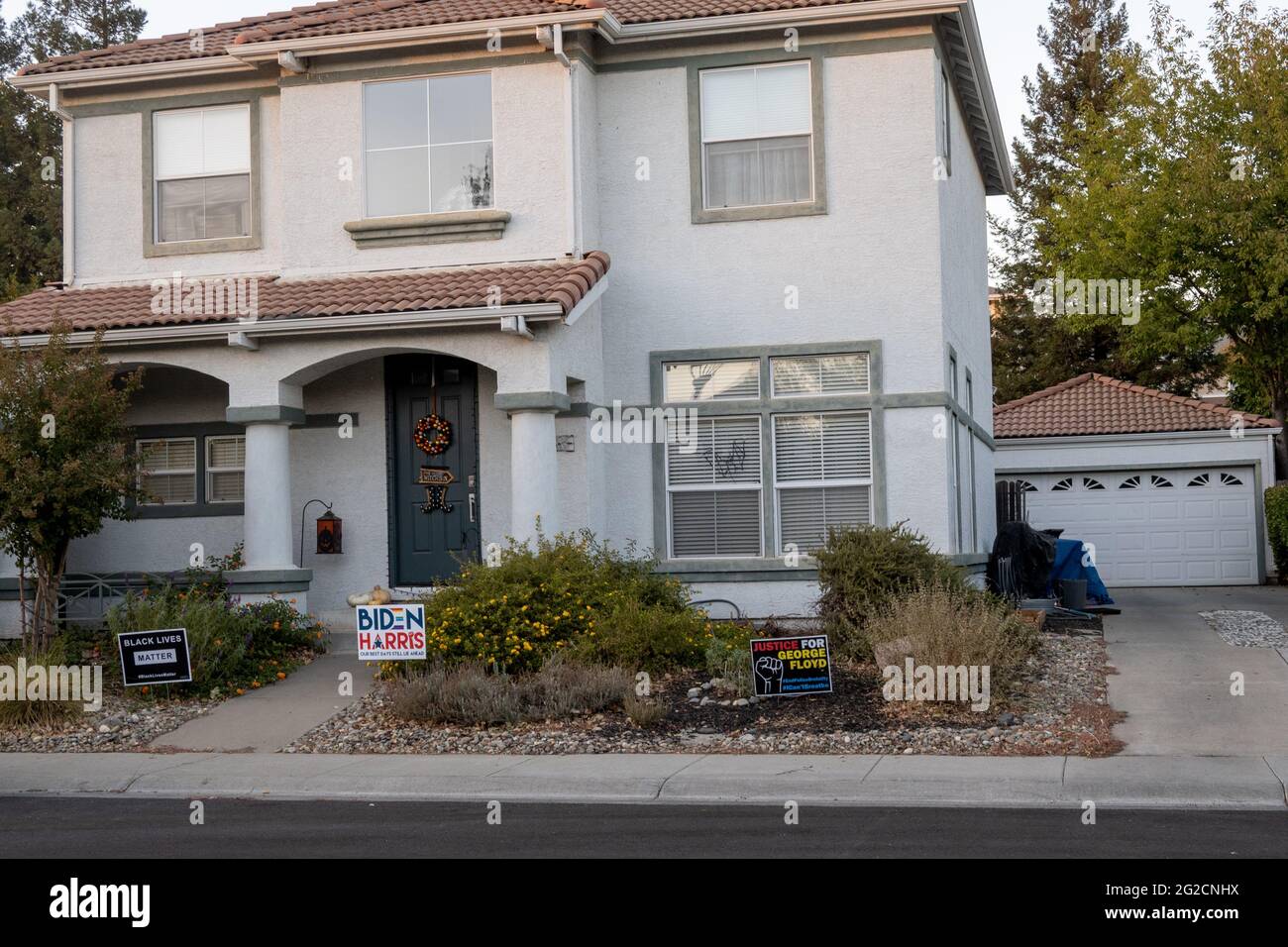 Davis, California, USA, 31 October 2020. Home decorated for Halloween with  signs supporting Bidenand the black lives matter movement Stock Photo
