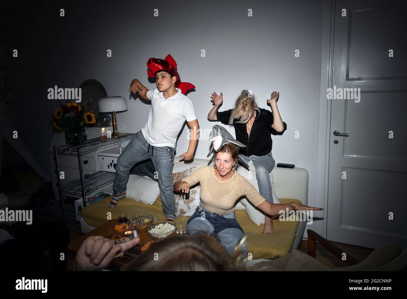 Family playing in living room Stock Photo - Alamy