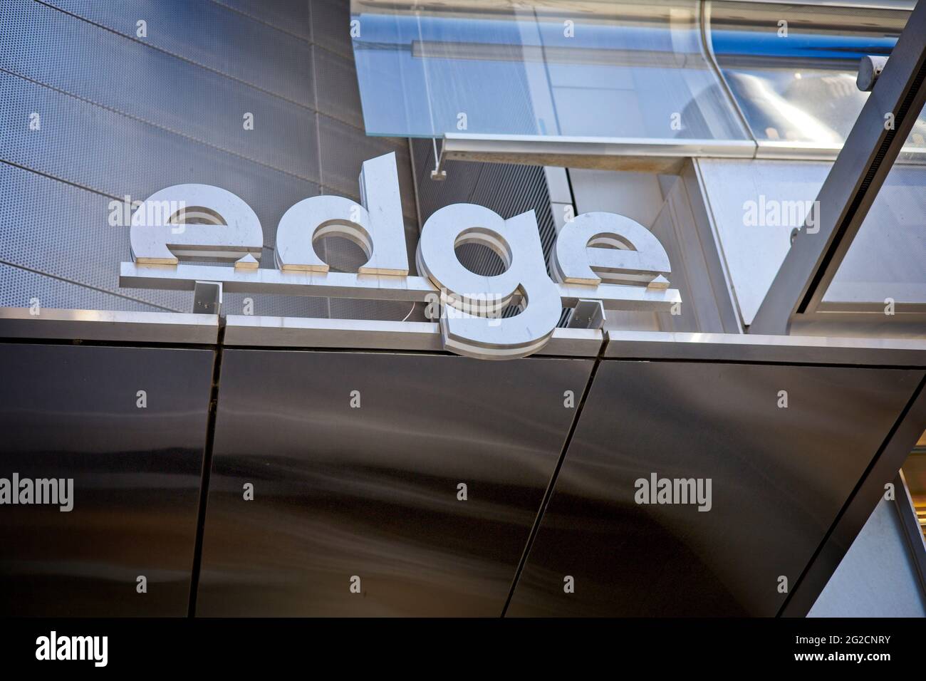 New York, NY, USA - June 10, 2021: The entrance to The Edge skyscraper with a modern metallic logo Stock Photo
