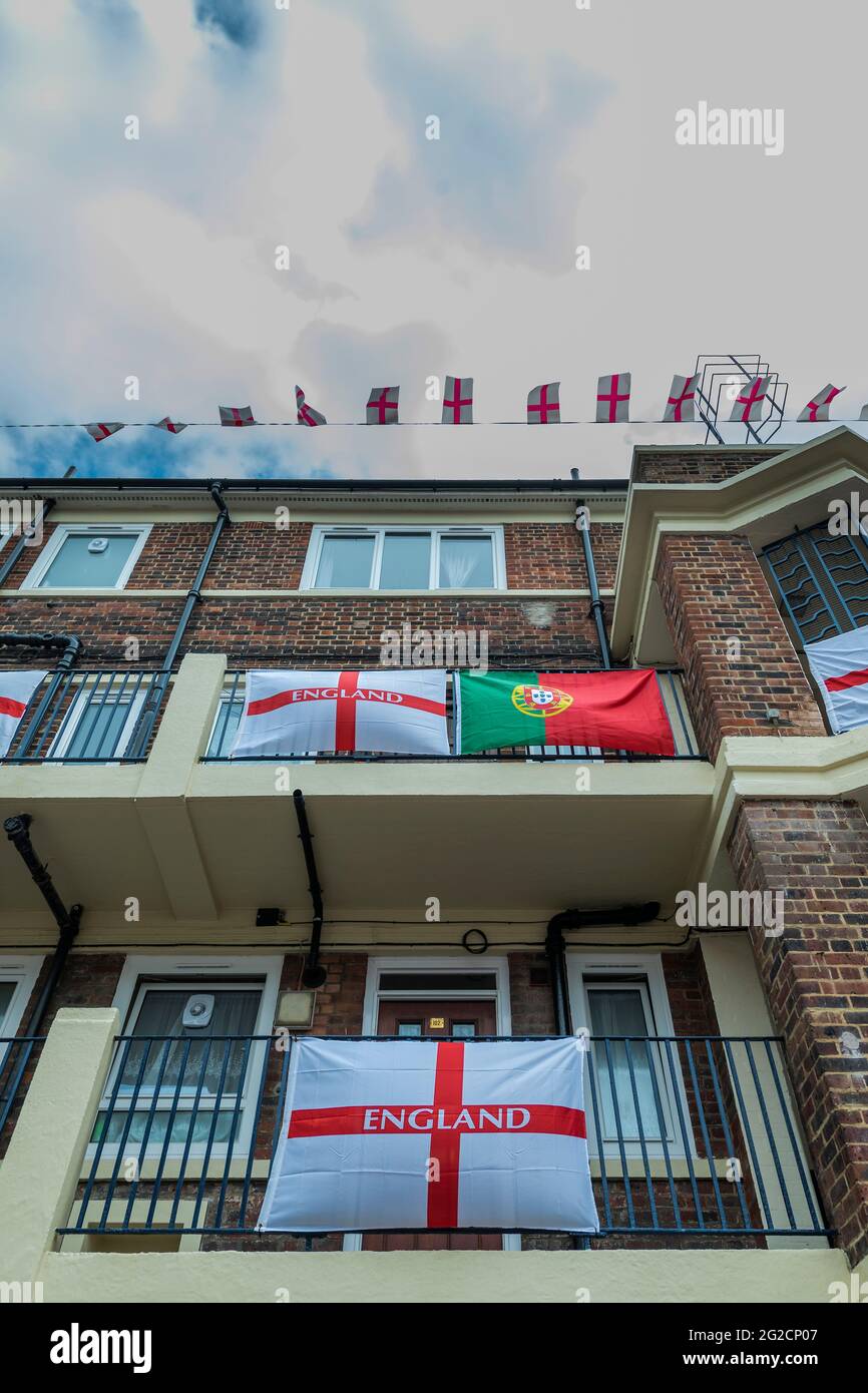 London, UK. 10th June, 2021. A solitary Portuguese (Portugal) flag - Football-mad residents in Bermondsey's Kirby Estate in south-east London have put up around 400 England (cross of St George) flags ahead of the European Championship which starts this weekend and is in fact the Covid-delayed 2020 tournament. Credit: Guy Bell/Alamy Live News Stock Photo
