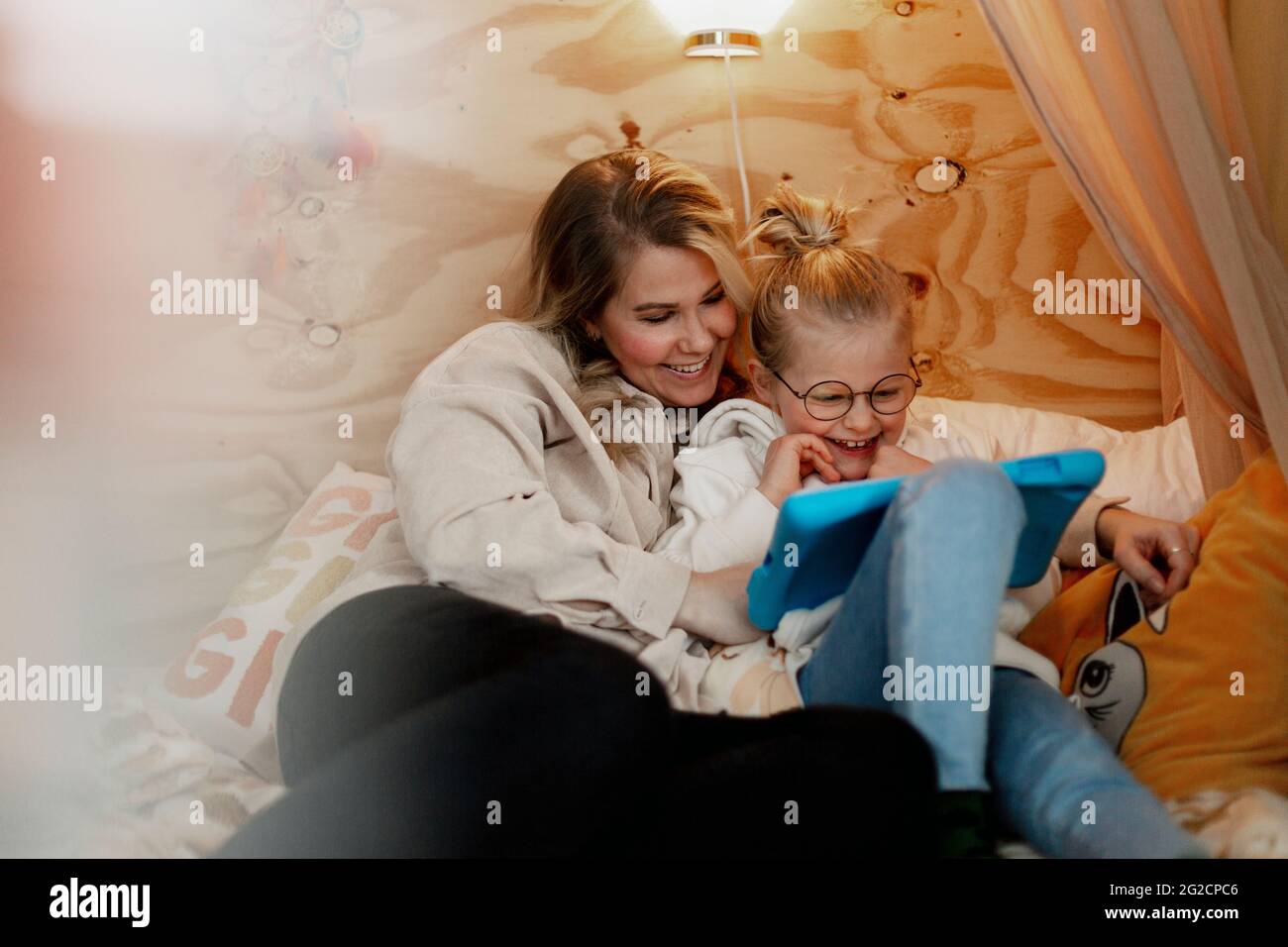 Mother with daughter using digital tablet Stock Photo