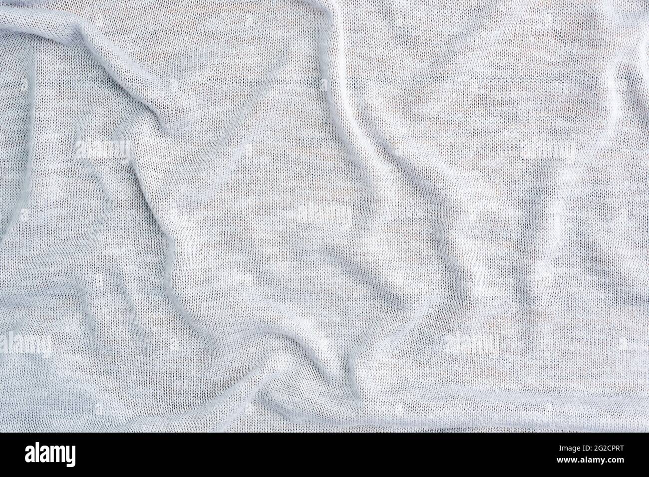 Background is made of gray textile material, the texture of a piece of clothing. Stock Photo
