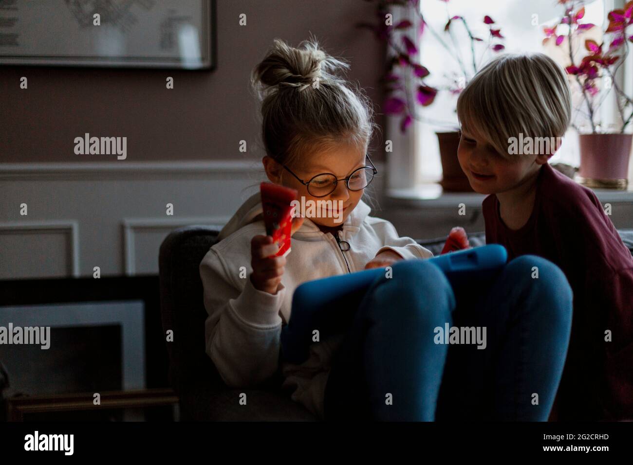 brother and sister using digital tablet Stock Photo