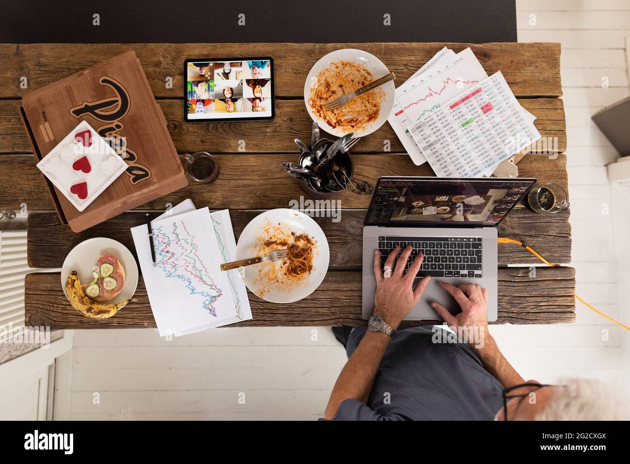 High angle view of man using laptop Stock Photo