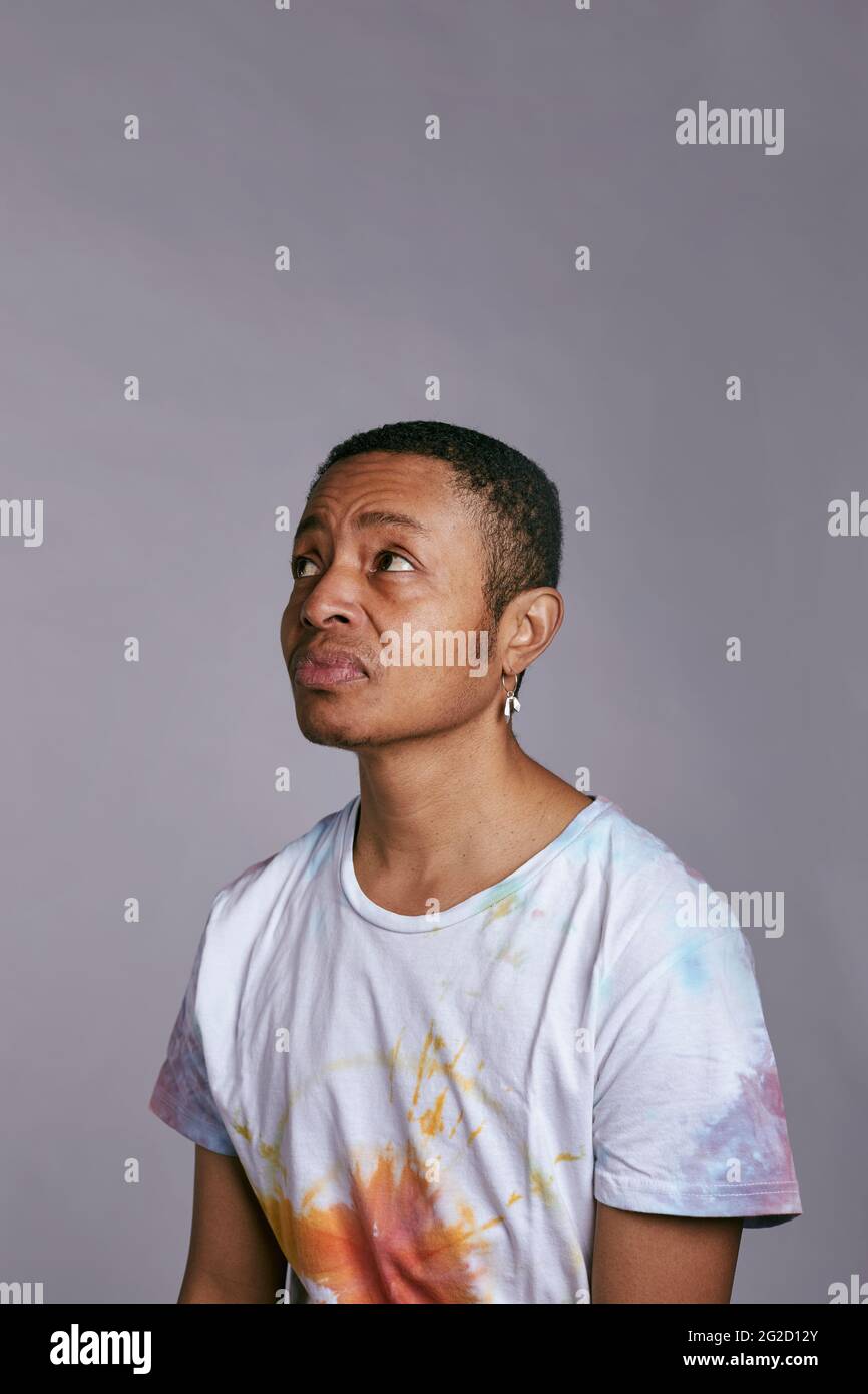 Man looking away, studio shot Stock Photo