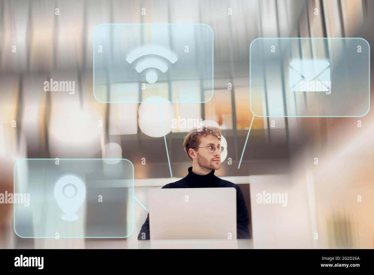Young man using various services on laptop Stock Photo