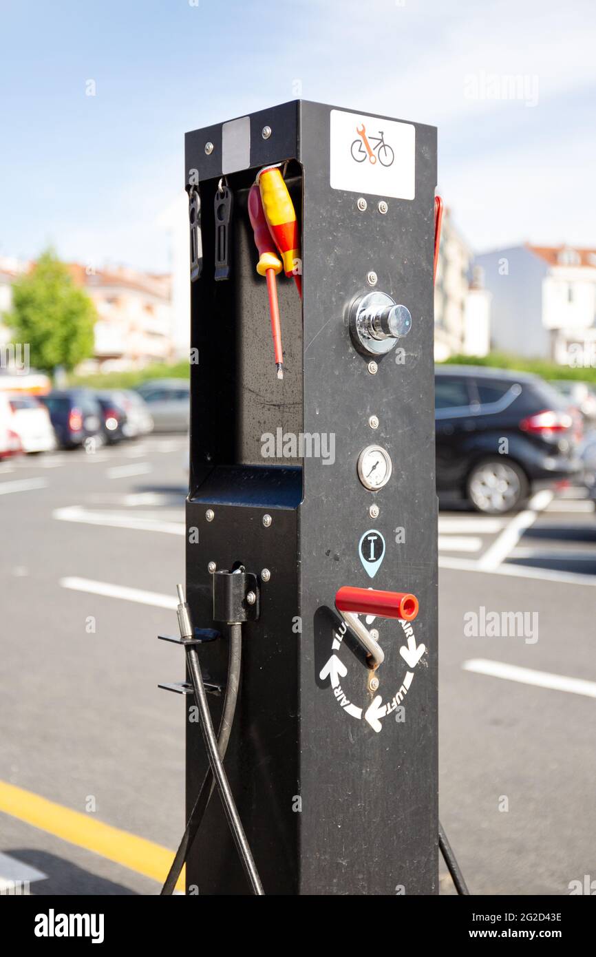 Free Bike clean and repair post located in a outdoor public car parking.  Galicia, Spain Stock Photo - Alamy
