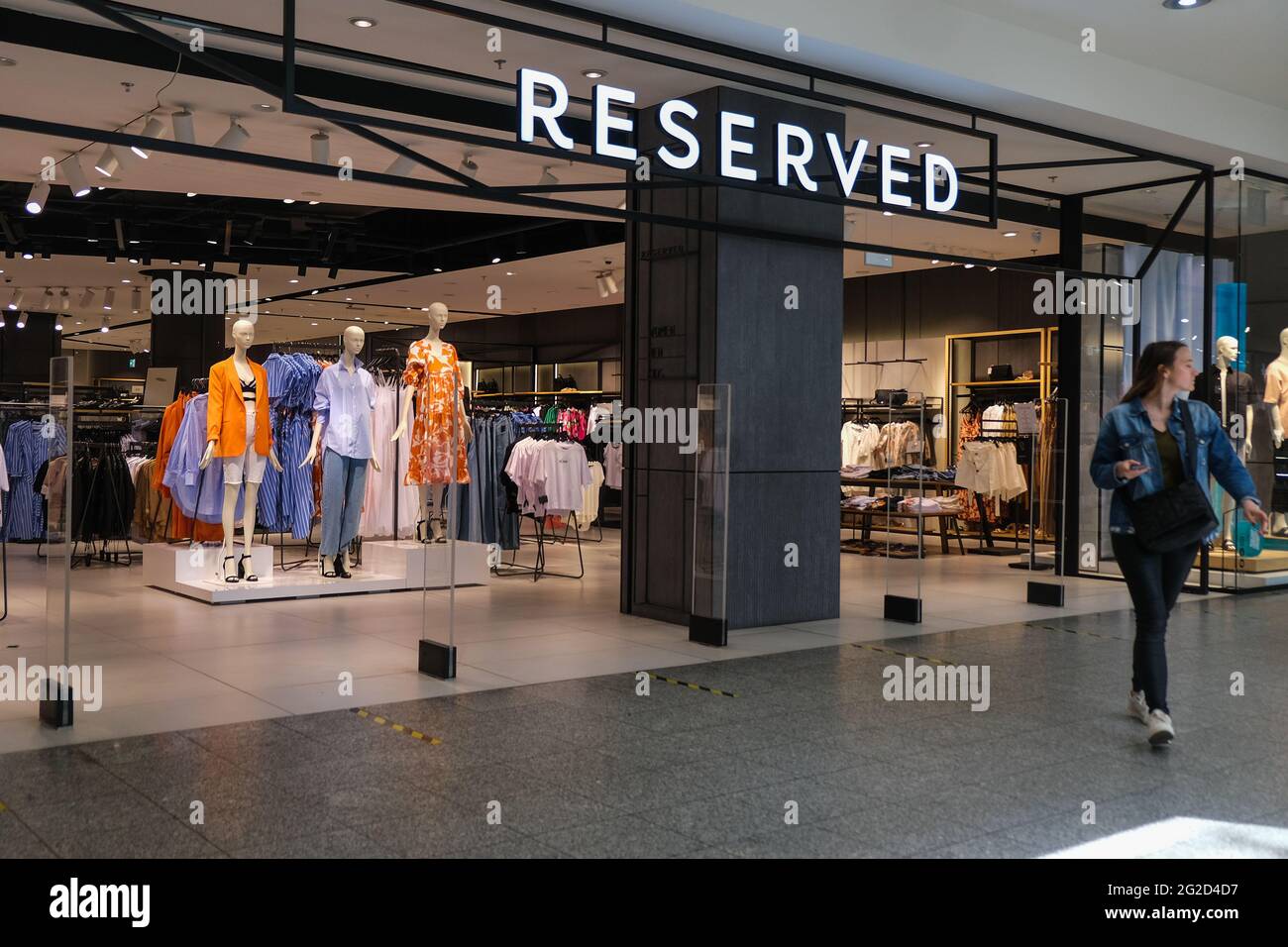Krakow, Poland. 10th June, 2021. A woman walks past a Reserved shop inside  a shopping mall. (Photo by Omar Marques/SOPA Images/Sipa USA) Credit: Sipa  USA/Alamy Live News Stock Photo - Alamy