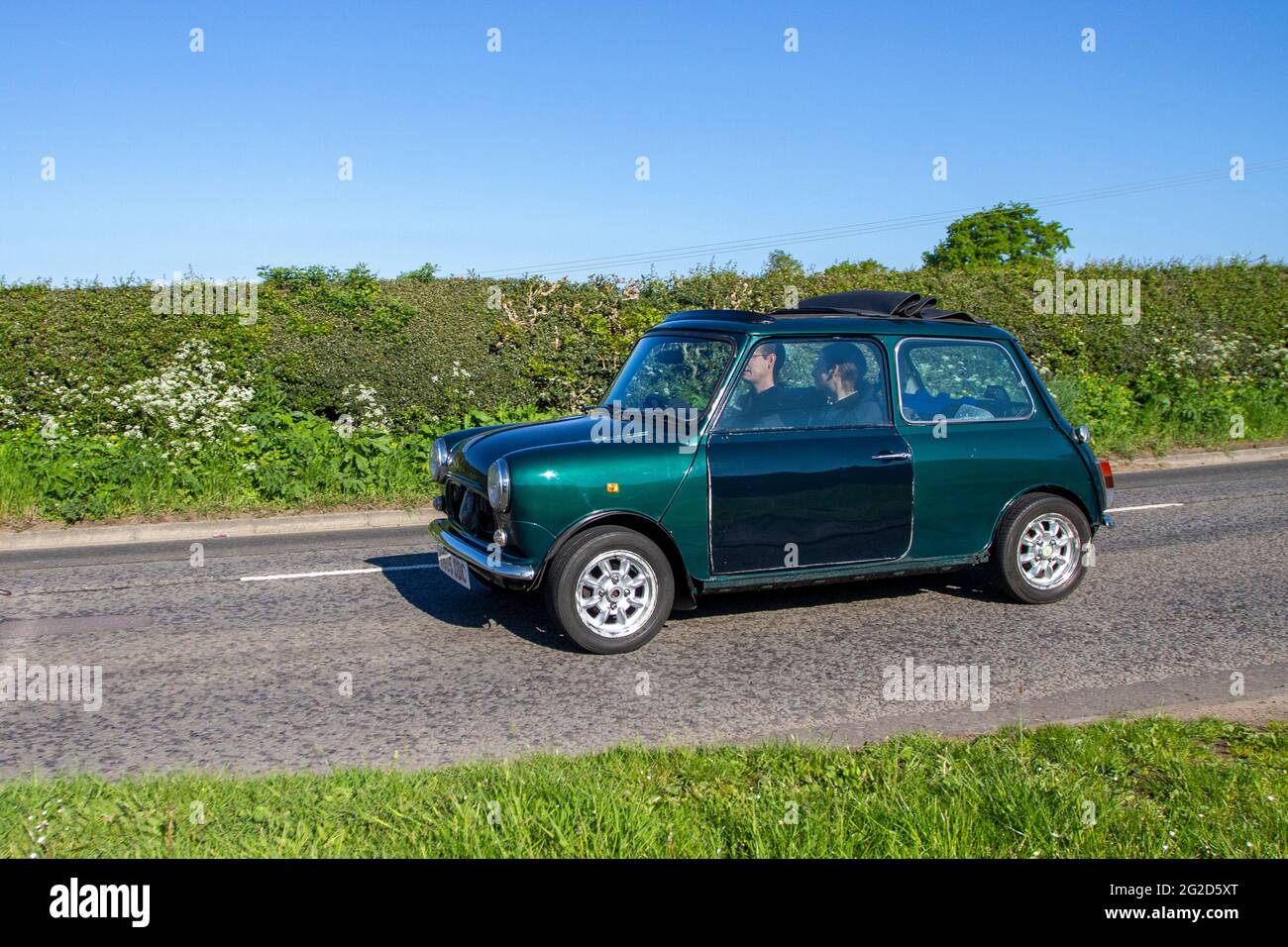 1992 90s green Mini British Open Classic en-route to Capesthorne Hall classic May car show, Cheshire, UK Stock Photo