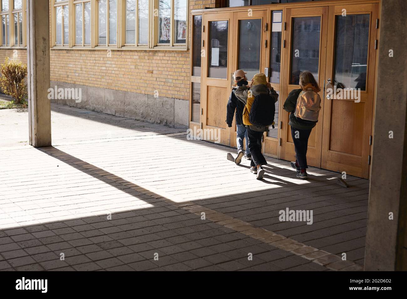 Children entering school Stock Photo
