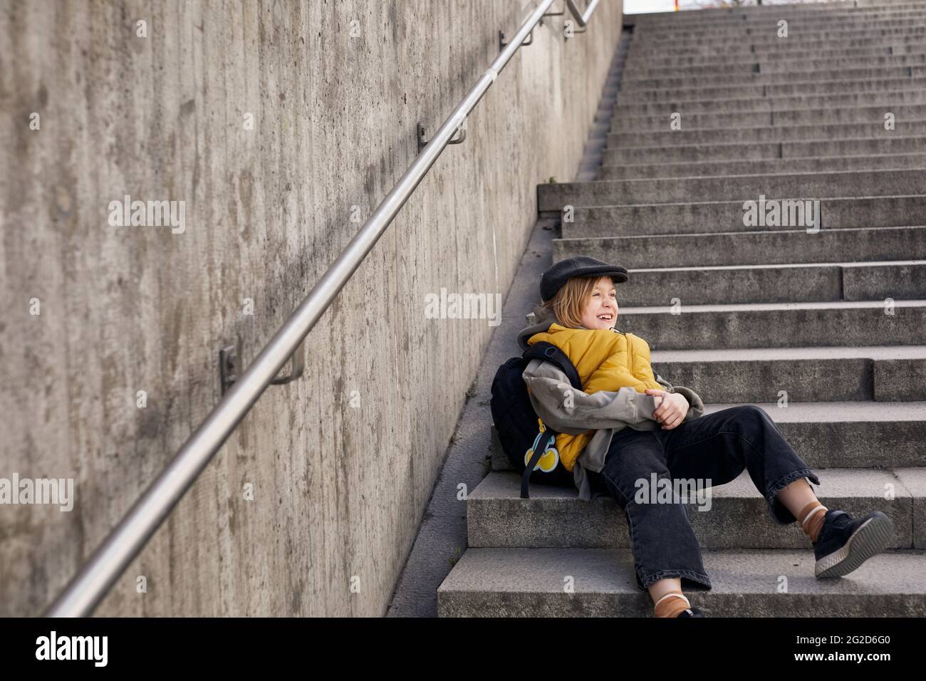 Girl sitting on stairs hi-res stock photography and images - Alamy