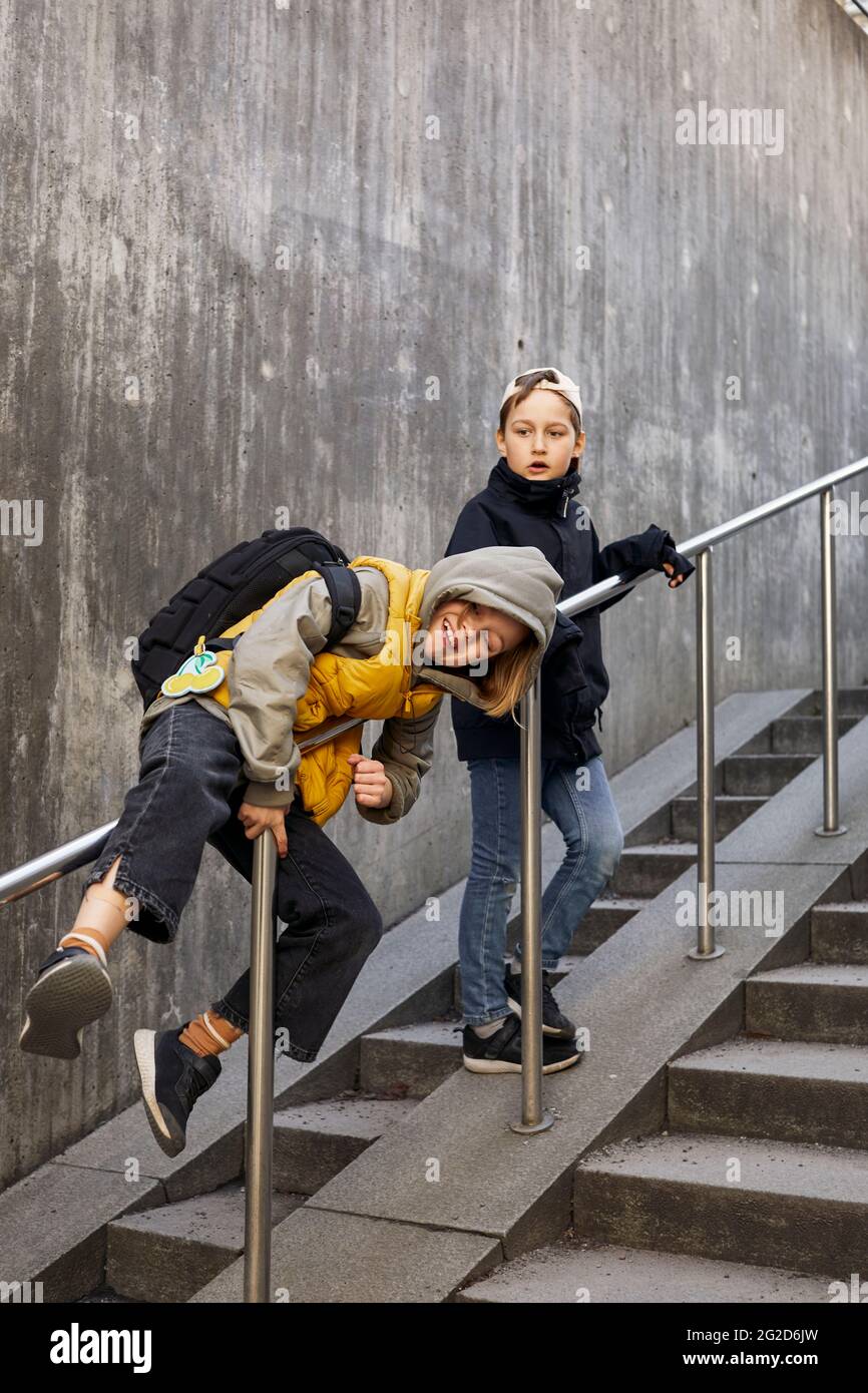 Children playing on stairs Stock Photo