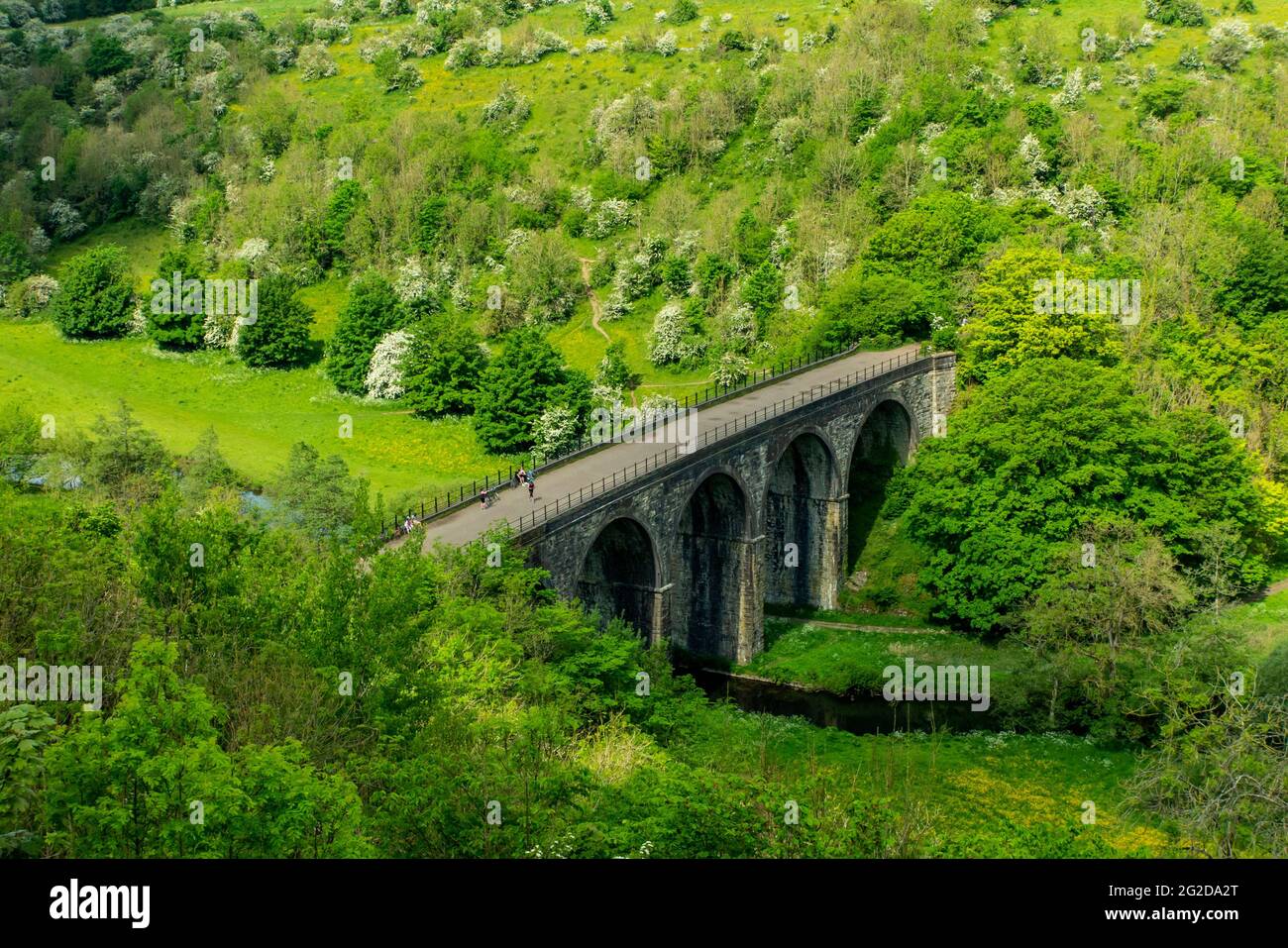 Early summer at Monsal Head a popular viewpoint in the Peak District National Park Derbyshire England UK with Monsal Viaduct in foreground. Stock Photo