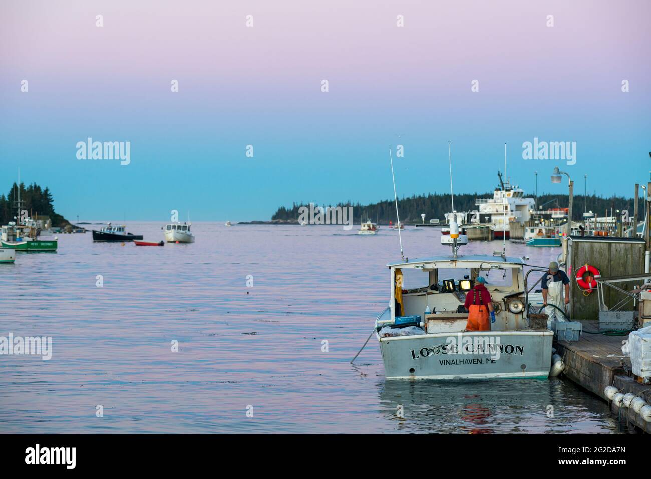 Lobstermen Unloading Lobster Catch, Carvers Harbor, Vinalhaven Island, Maine, USA Stock Photo