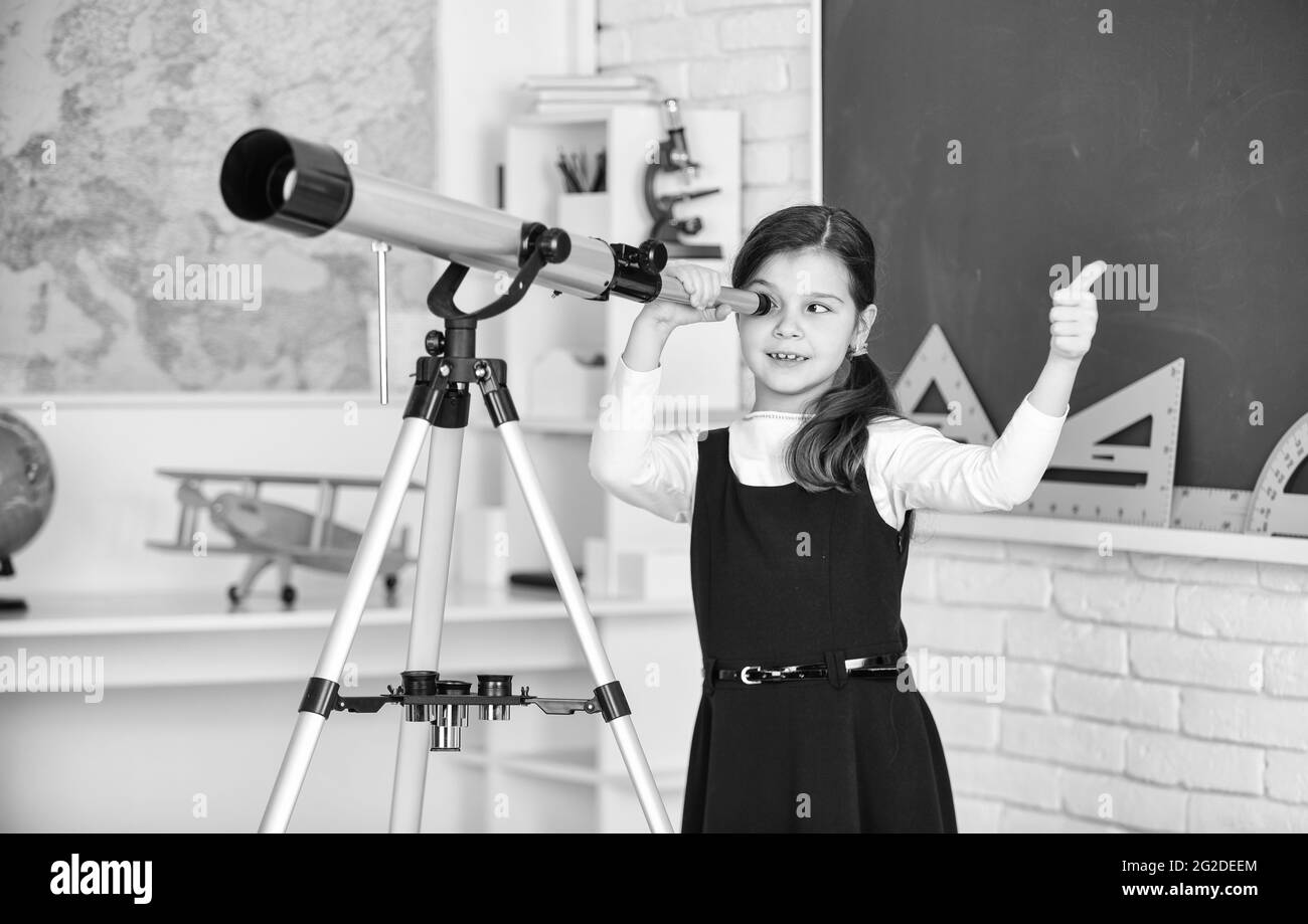 teachers day. Little girl using telescope. Telescope on tripod. School subjects set. School