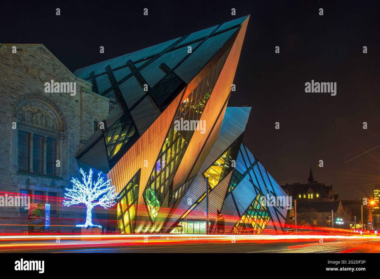 The Royal Ontario Museum lit up at night in brilliant, multi-colour lights during the Christmas season. Stock Photo