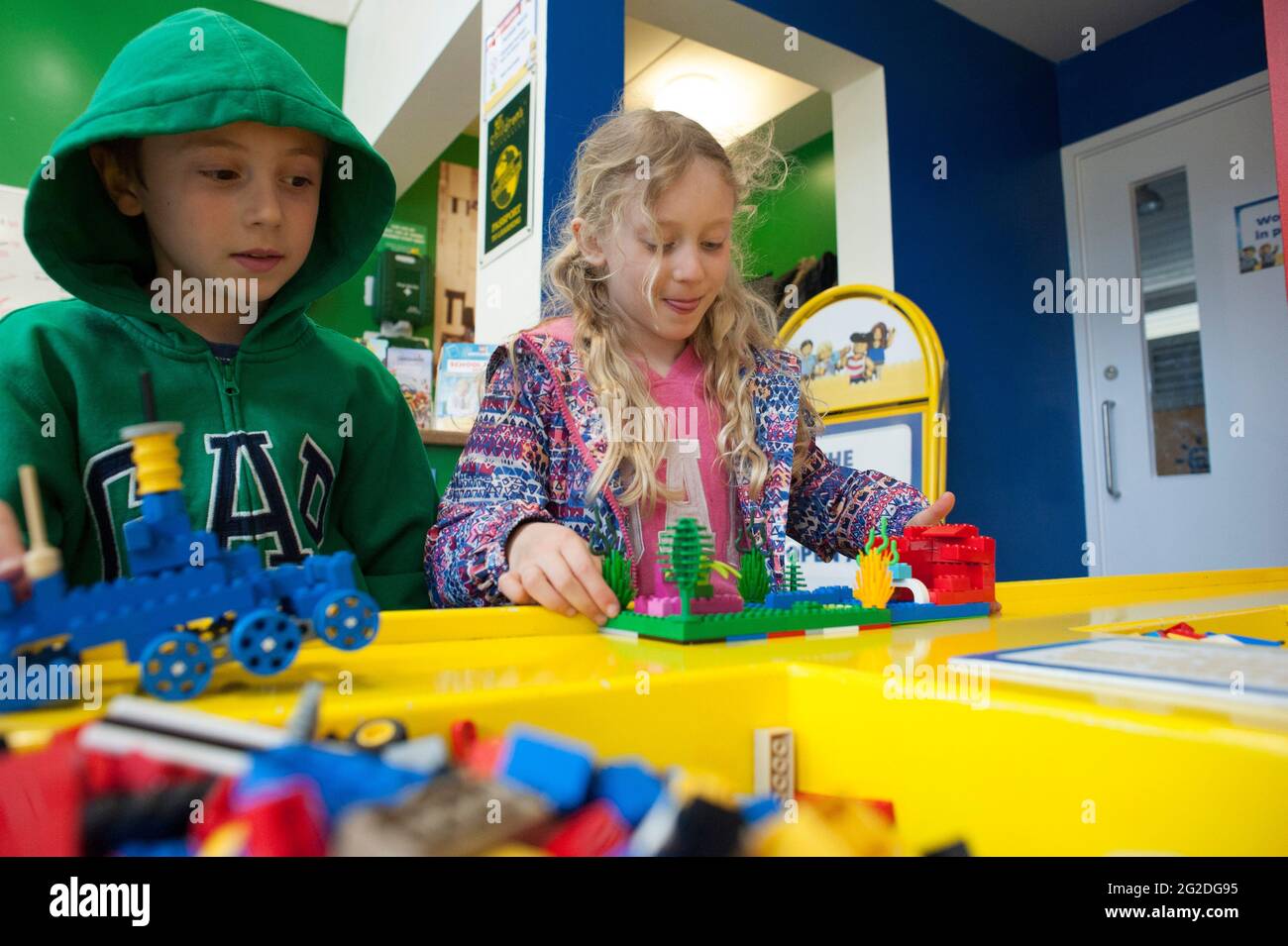 Kids playing with lego toys Stock Photo