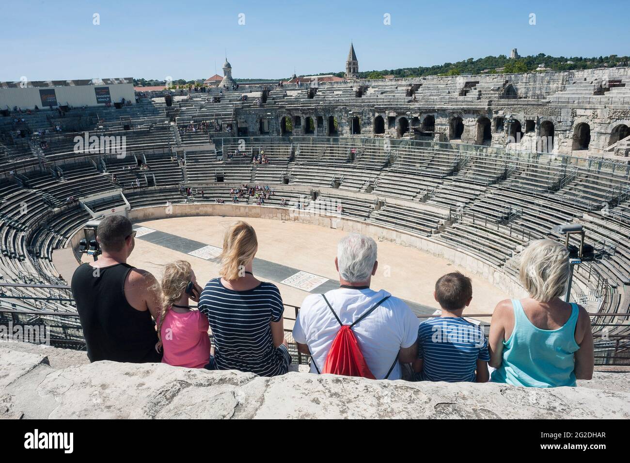 Tourists looking at the Arena of Nîmes in Southern France Stock Photo
