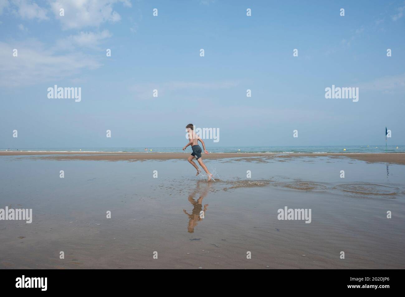 A family exploring the D Day sights of Normandy and learning about the history. Stock Photo