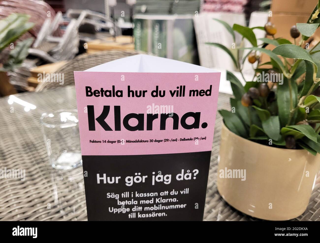 Information about Klarna in a store. The company Klarna provides payment  solutions for the e-commerce industry, where consumers receive the product  first and pay afterwards when they shop online Stock Photo -
