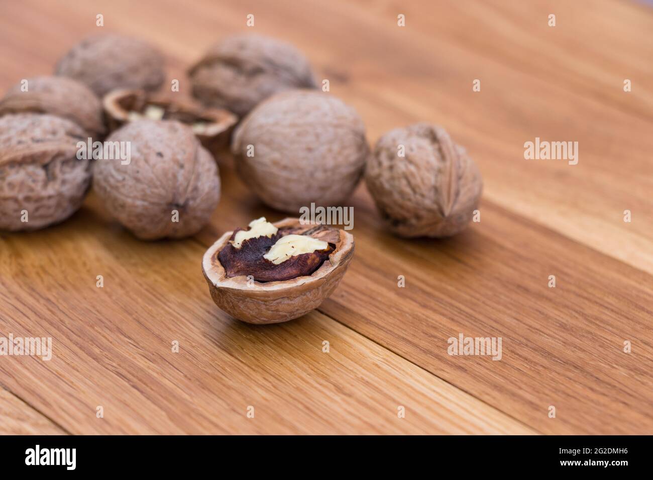 Stack Walnuts on wooden background. Walnut kernels close-up. Stock Photo
