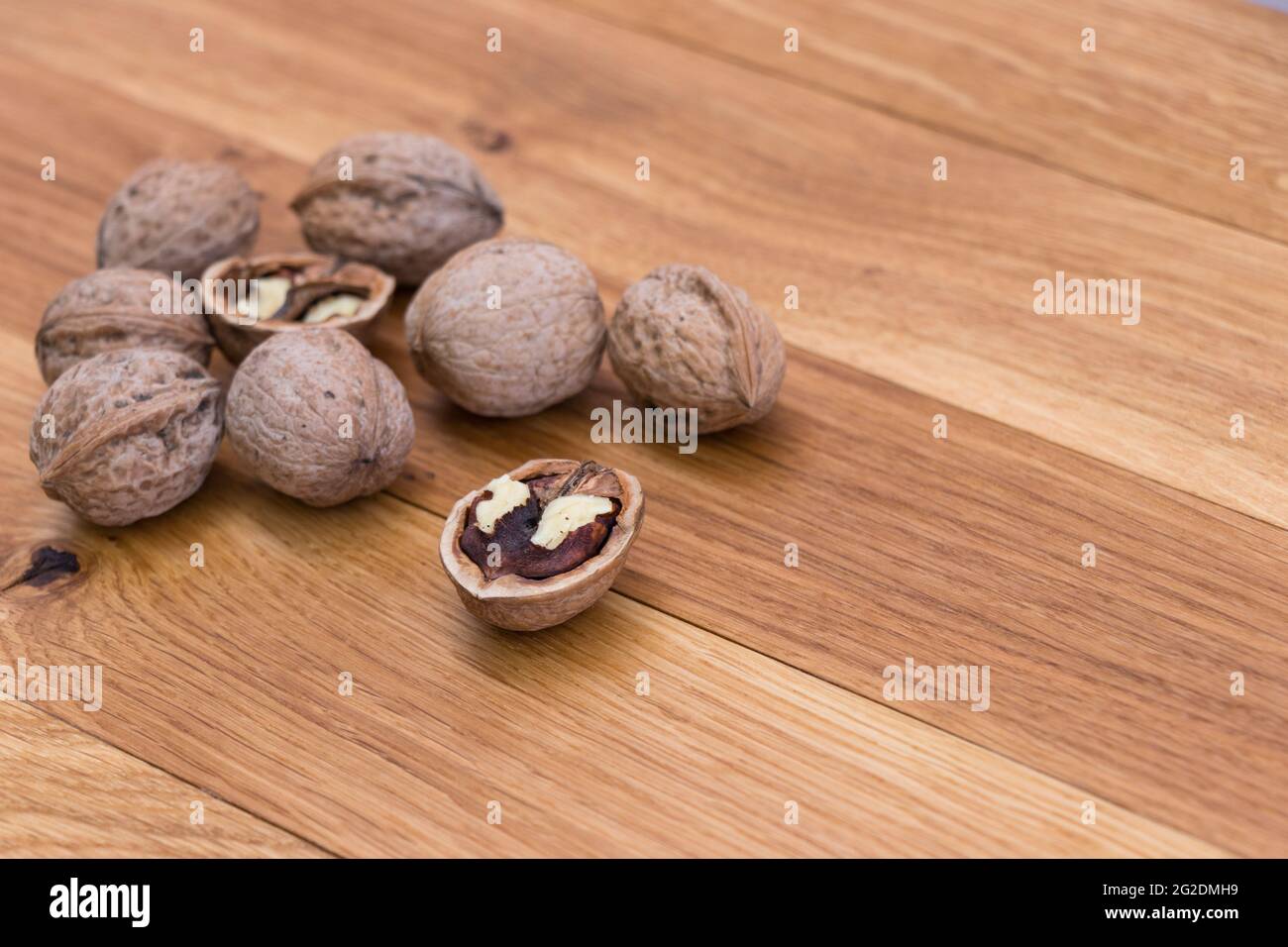 Stack Walnuts on wooden background. Walnut kernels close-up. Stock Photo