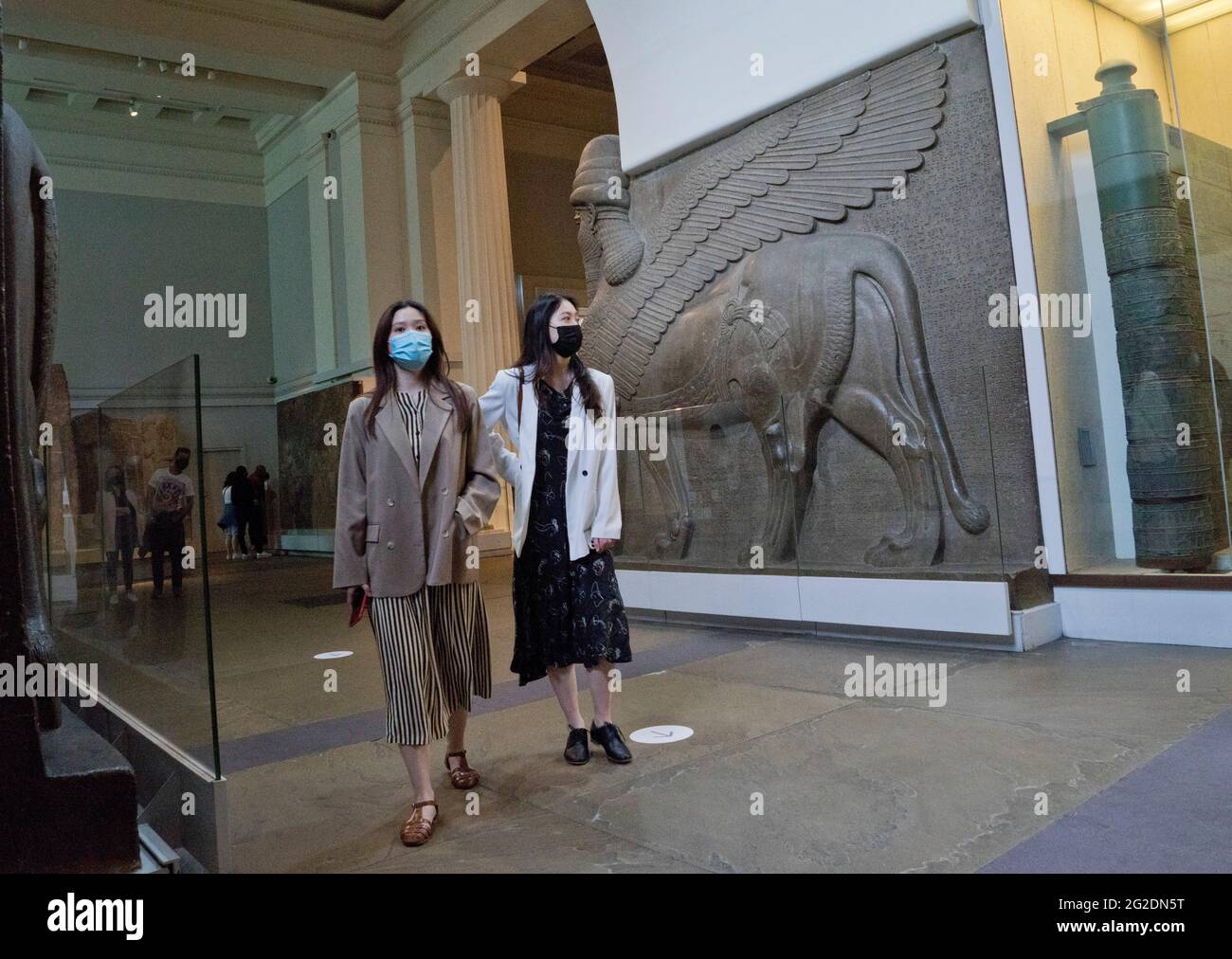 Visitors to the British Museum in London wearing masks due to the COVID-19 pandemic.  England, UK. Stock Photo