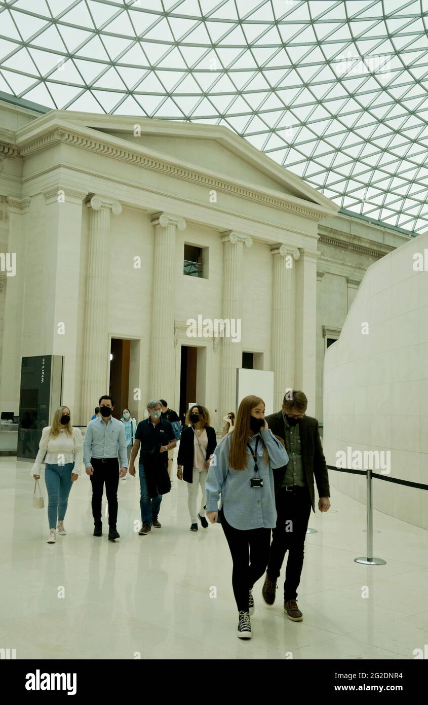 Visitors to the British Museum in London wearing masks due to the COVID-19 pandemic.  England, UK. Stock Photo