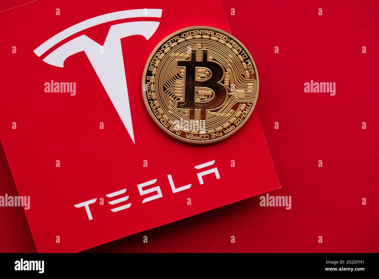 LONDON, UK June 2021 Bitcoin cryptocurrency on a Tesla electric
