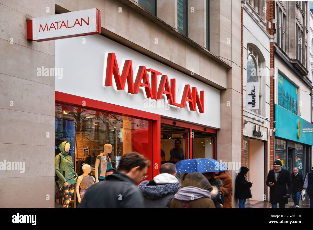 London, United Kingdom - February 01, 2019: People walking in front of Matalan store on Oxford Street entrance with bright red logo. It is British fas Stock Photo