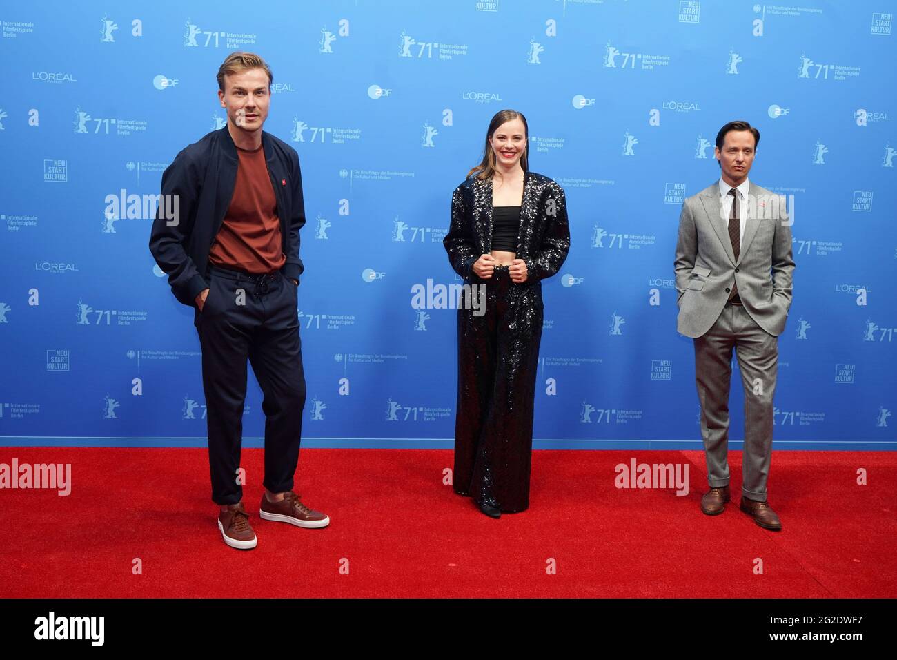 Actors Albrecht Schuch, Saskia Rosendahl and Tom Schilling pose on the red  carpet for the screening of the film "Fabian oder Der Gang vor die Hunde"  (Fabian - Going to the Dogs)