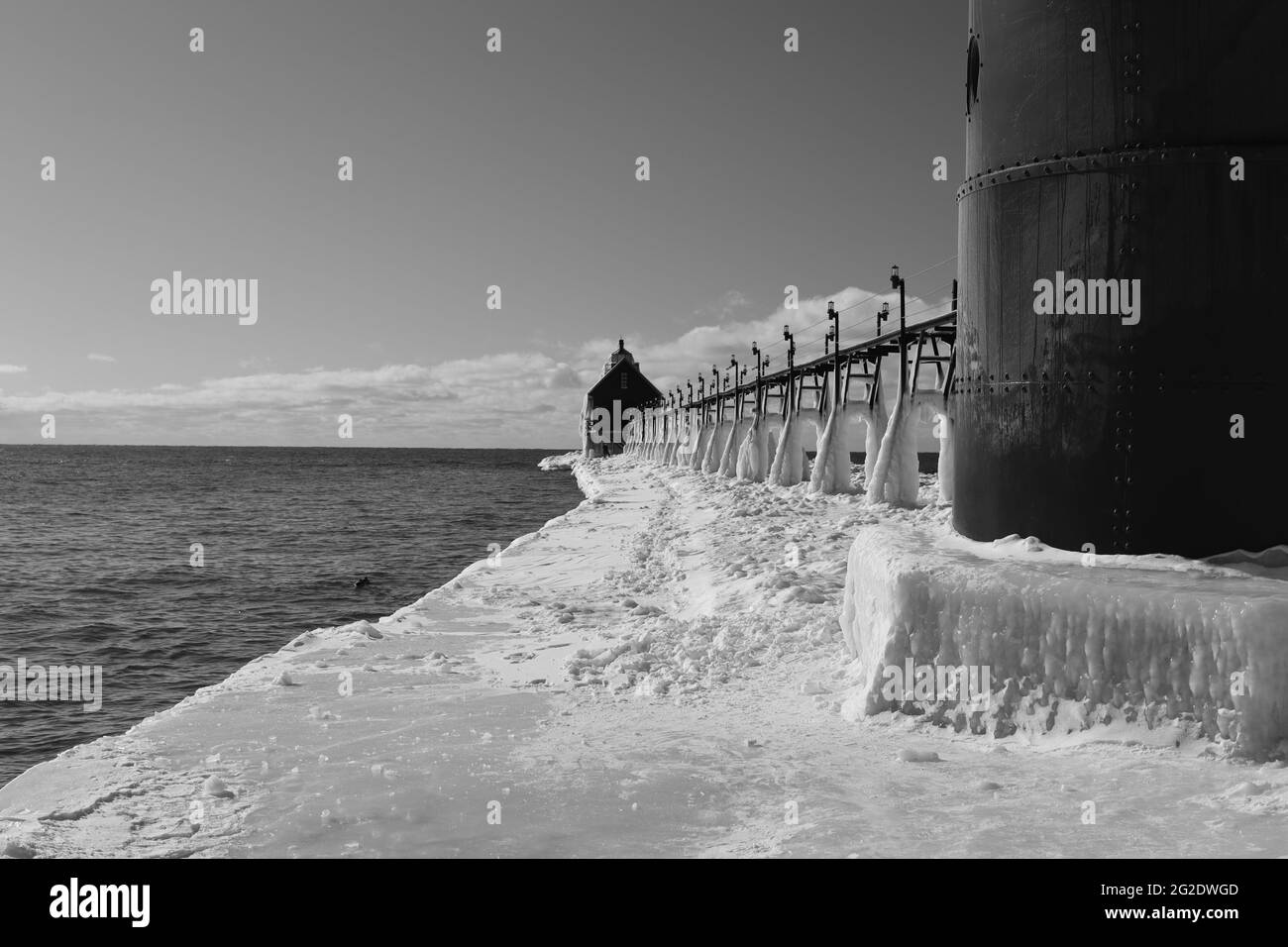 Closeup grayscale shot of grand haven lighthouse revetments in ice, Michigan Stock Photo