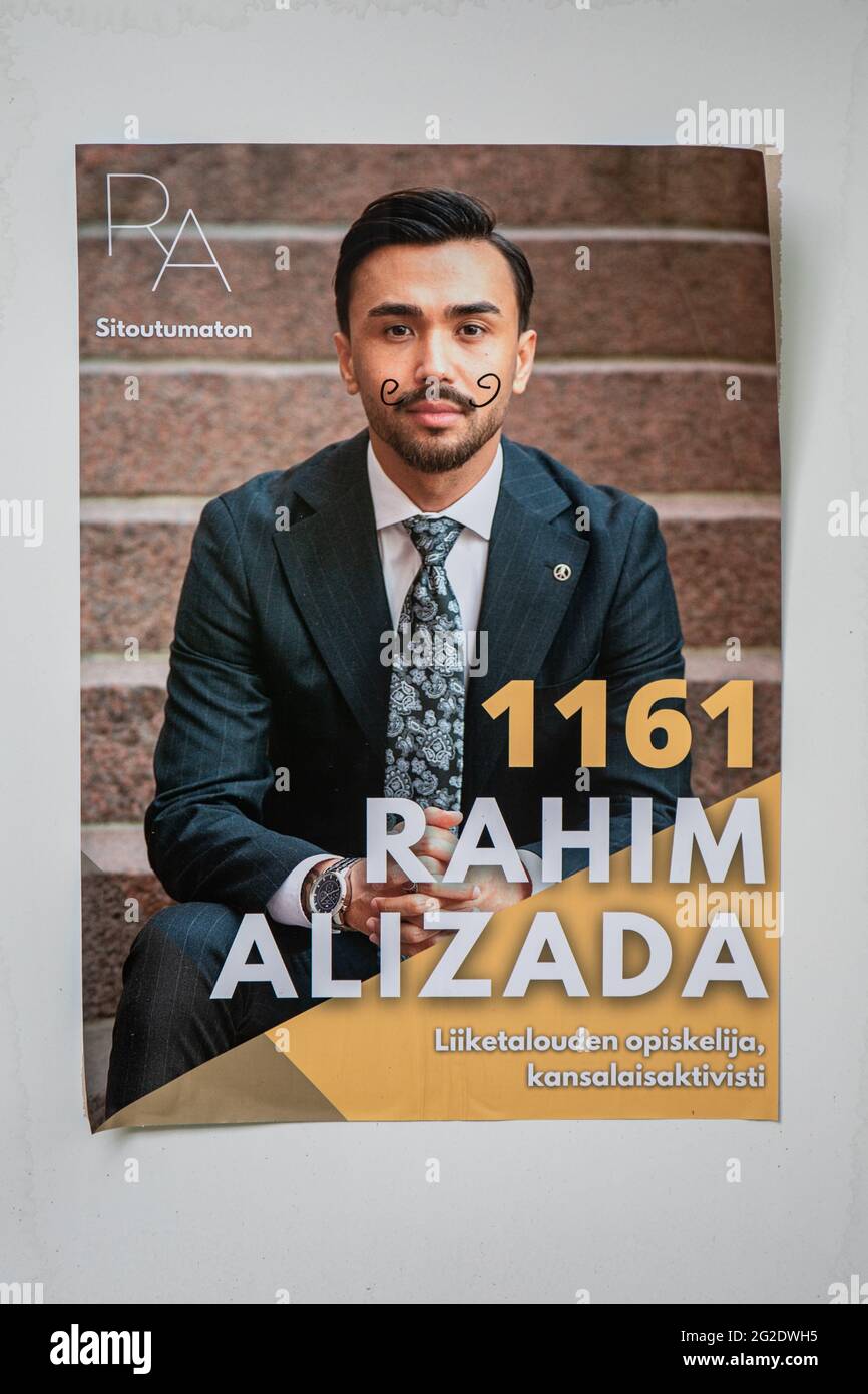 Hand drawn moustache on Rahim Alizada municipal elections campaign poster in Helsinki, Finland Stock Photo