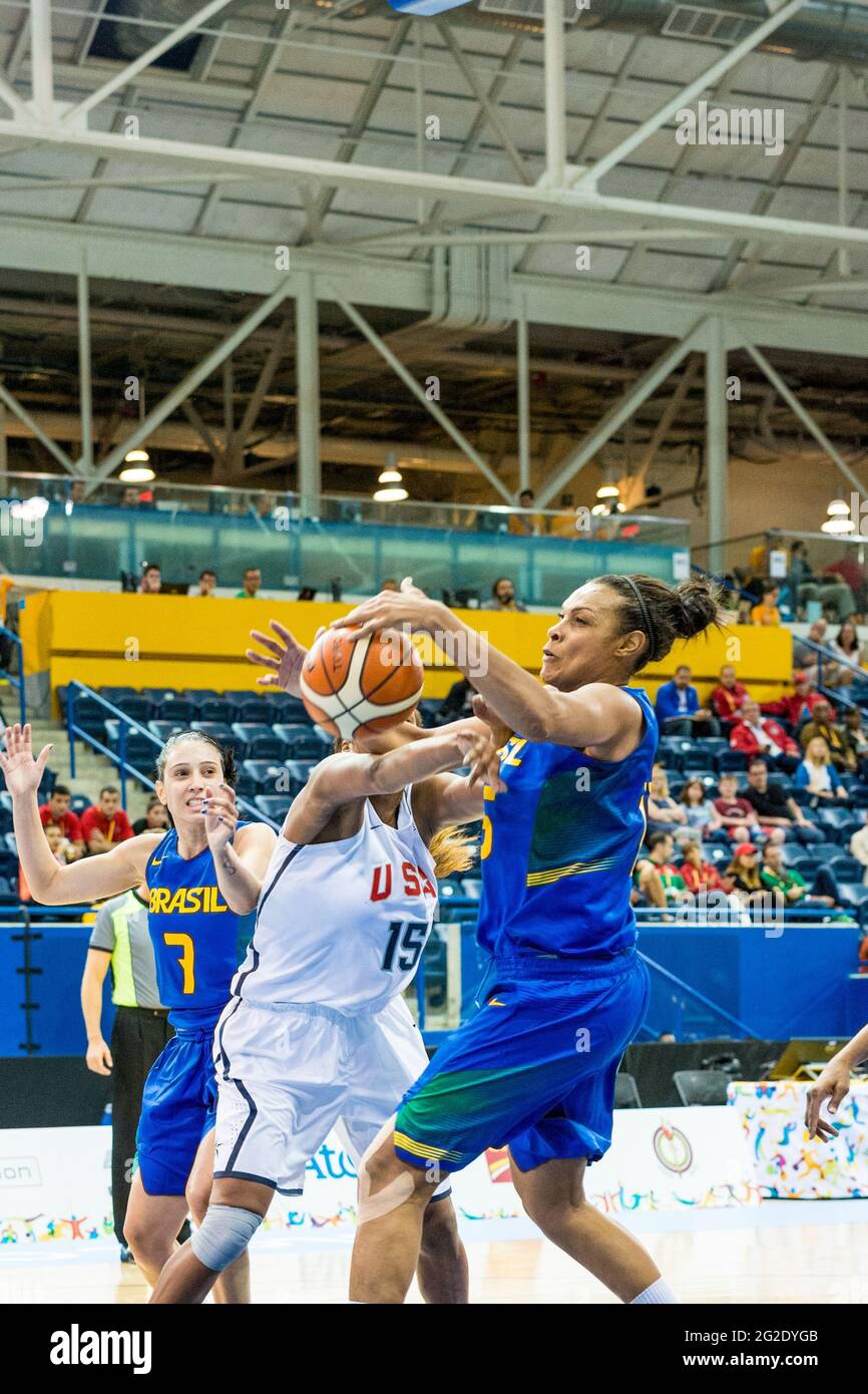Toronto 2015 Pan Am or Pan American Games, women basketball: Kelly Santos (right blue uniform) from Brazil takes the ball from the United States forwa Stock Photo