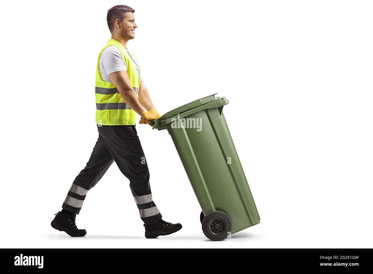 Full length profile shot of a waste collector pushing a plastic bin isolated on white background Stock Photo