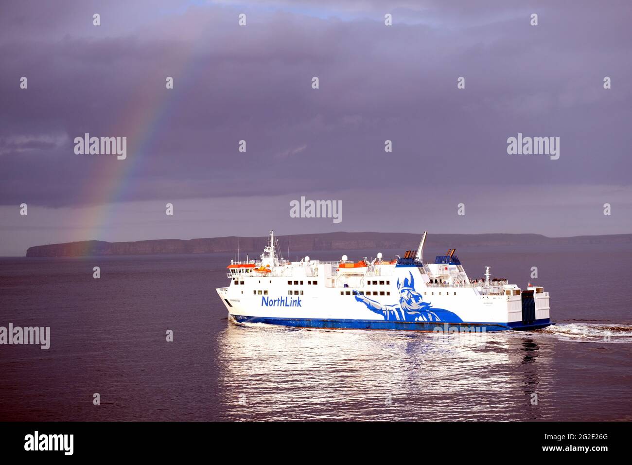 UNITED KINGDOM; RAINBOW OVER THE NORTHLINK FERRY 'HAMNAVOE' EN ROUTE TO THE ORKNEY ISLANDS FROM SCRABSTER Stock Photo