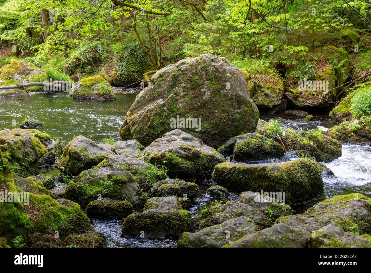 Moss Formations On Rocks Beautiful view of rock formations covered in moss in a river Stock ...