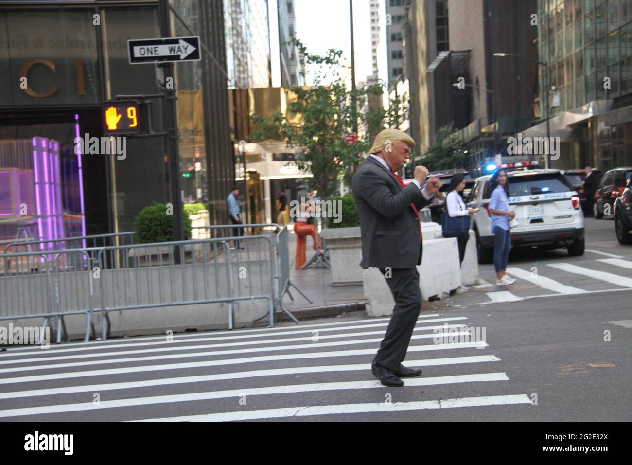 New York, USA. 10th June, 2021. (NEW) Donald Trump Look Alike Entertains Public at Trump Tower. June 10, 2021, New York, USA: Neil Harbinsson, who dresses up like former US President, Donald Trump, entertains people in front of Trump Tower on 5th Avenue, New York. He walks around, controls vehicle traffic and takes pictures with people.Credit: Niyi Fote/TheNews2 Credit: Niyi Fote/TheNEWS2/ZUMA Wire/Alamy Live News Stock Photo