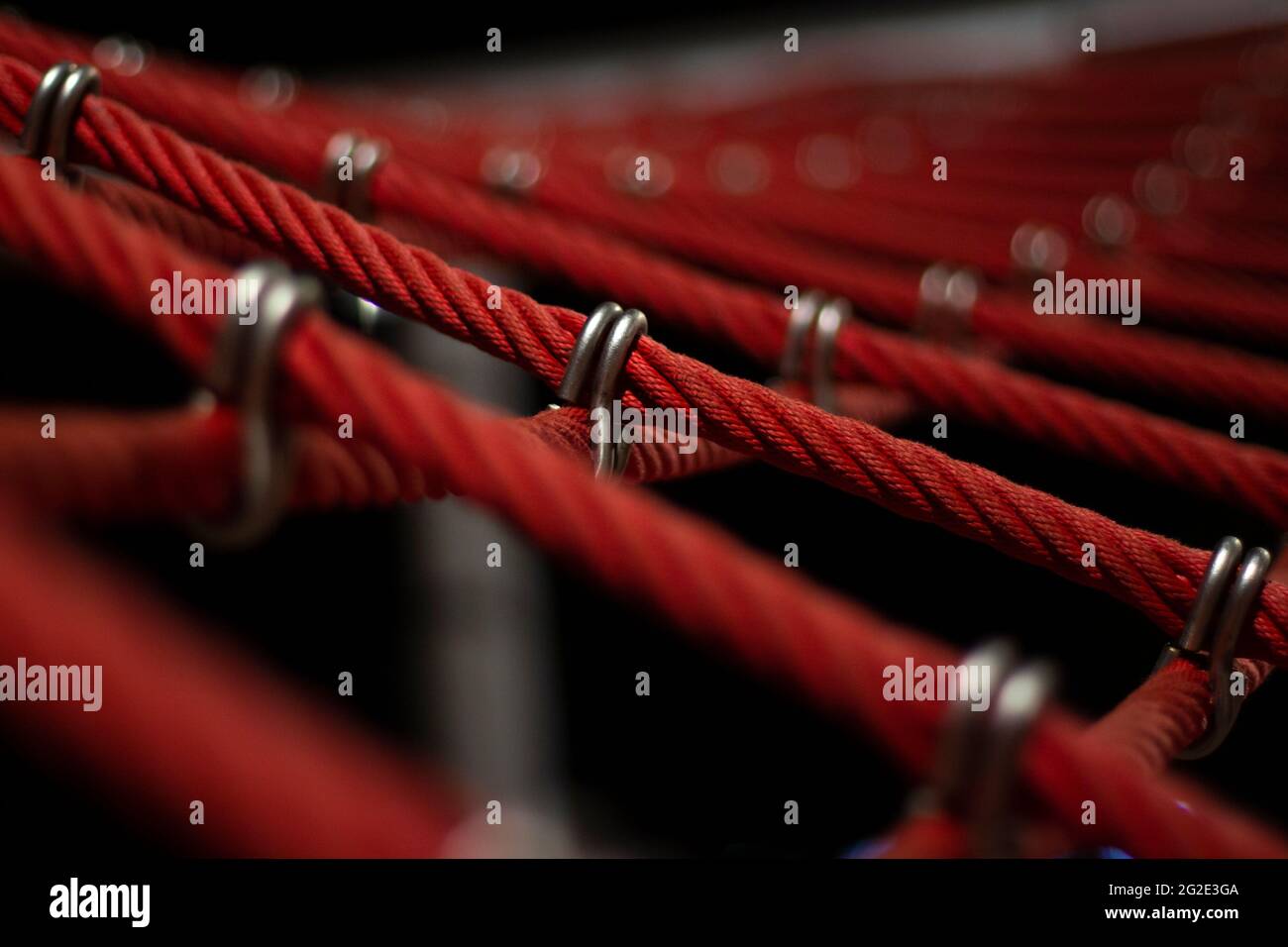 Ropes in the playground. Climbing net, shot close-up. Ropes fastened ...