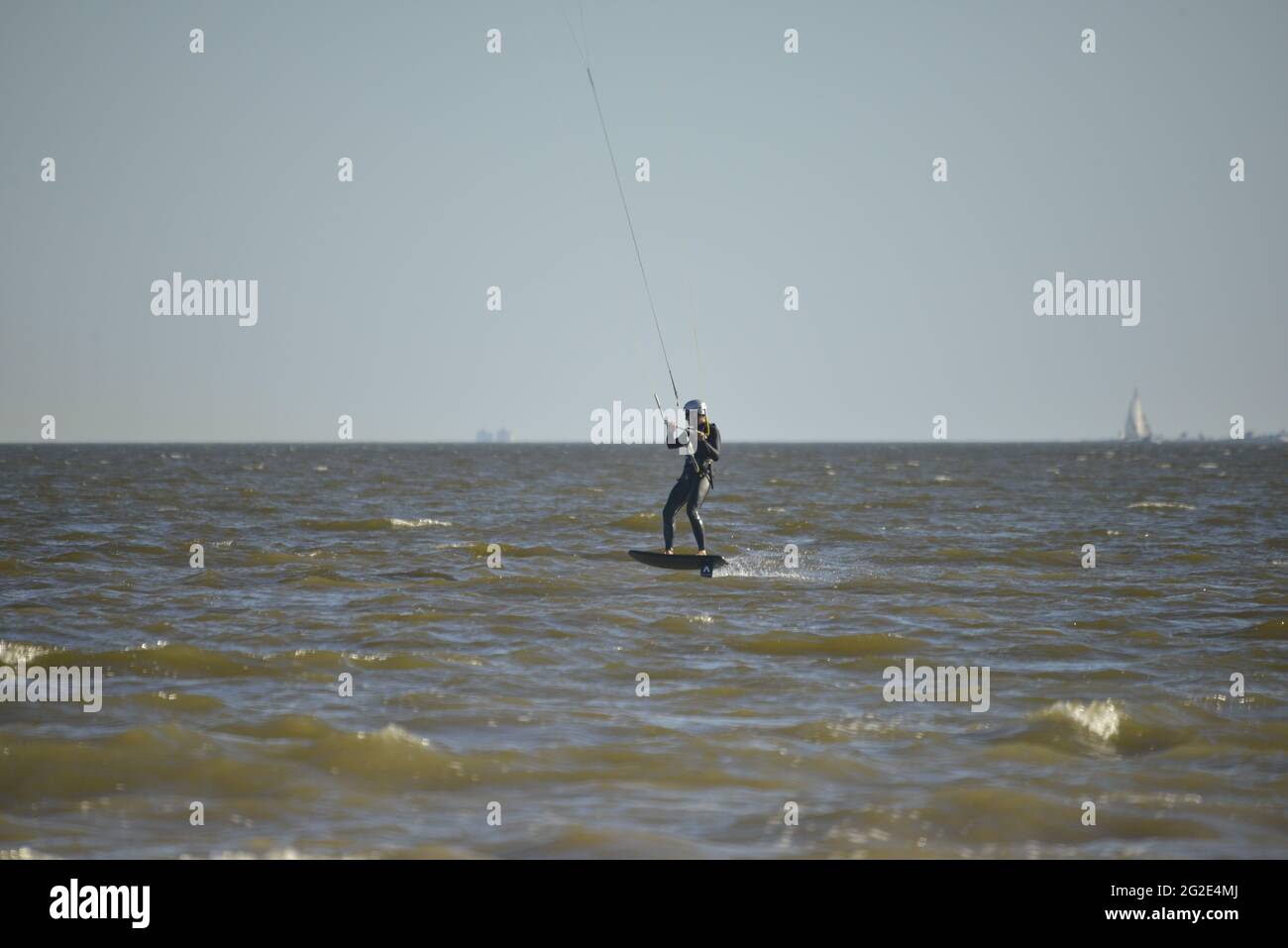 Kite surfing or kitebording in the ocean surf Stock Photo