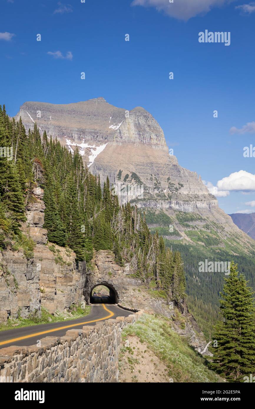 Going To The Sun road passes through tunnel with Going-To-The-Sun Mountain in background at Glacier National Park, Montana. Stock Photo