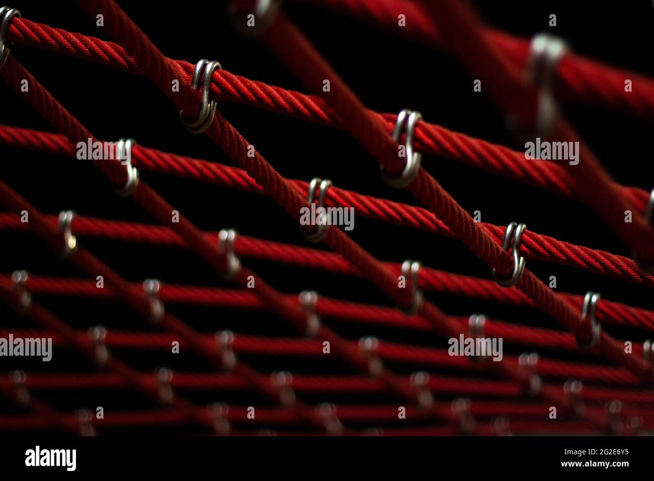 Ropes in the playground. Climbing net, shot close-up. Ropes fastened ...