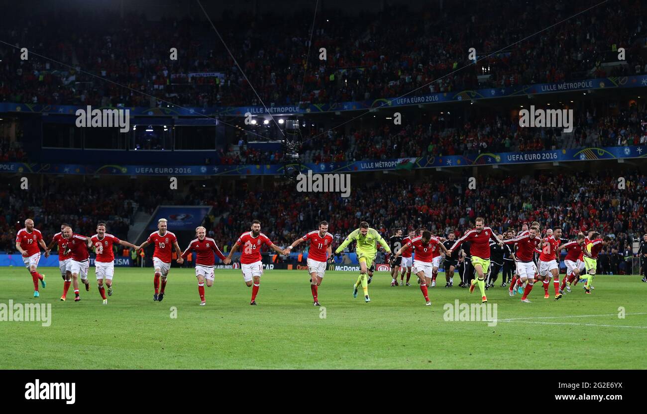 Wales players celebrate after winning the game. Belgium v Wales, UEFA Euro 2016 quarter-final match at the Stade Pierre Mauroy in Lille, France . July Stock Photo