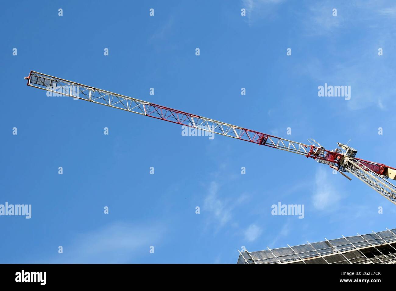 May 2, 2021. Tower crane high above with a blue sky background on the new home units building at 56-58 Beane St. Gosford.  Australia. Commercial use i Stock Photo