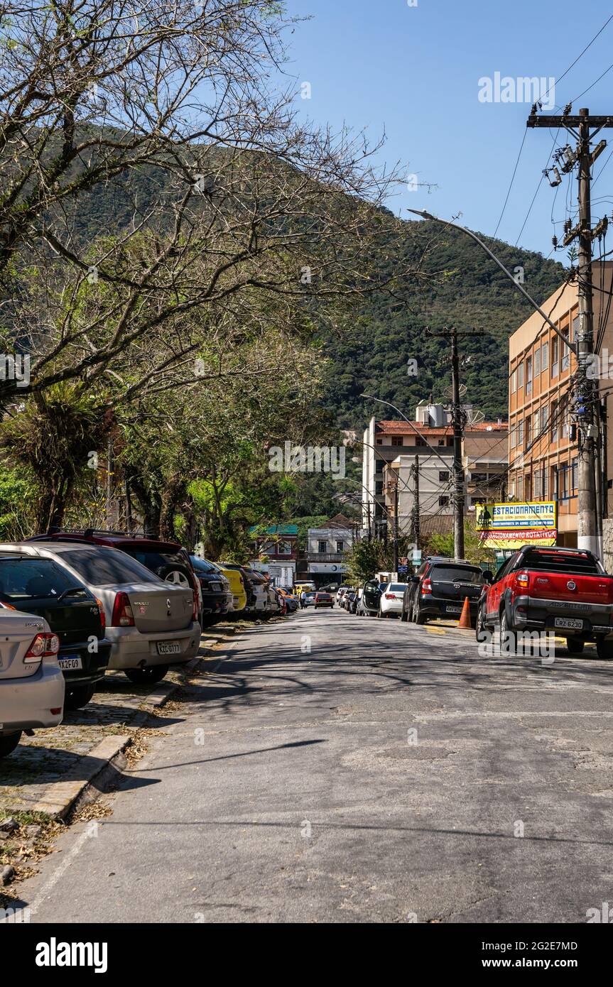 View of the Higino da Silveira square streets with many cars parked on both sides under sunny clear blue sky in Alto district. Stock Photo