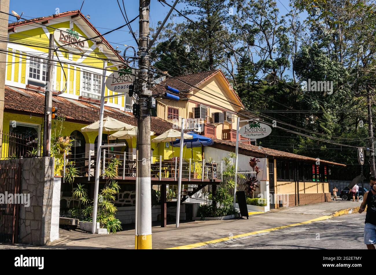 The colorful yellow and white facade of Botania inn and restaurant. Building located right at Higino da Silveira square in downtown, Alto district. Stock Photo