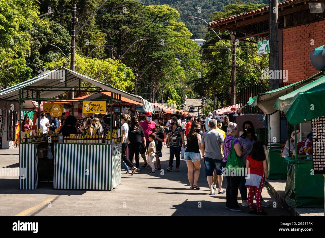 Crowds of people browsing items in Alto Fair tents, a public market located in the surroundings of Higino da Silveira square, Alto district. Stock Photo