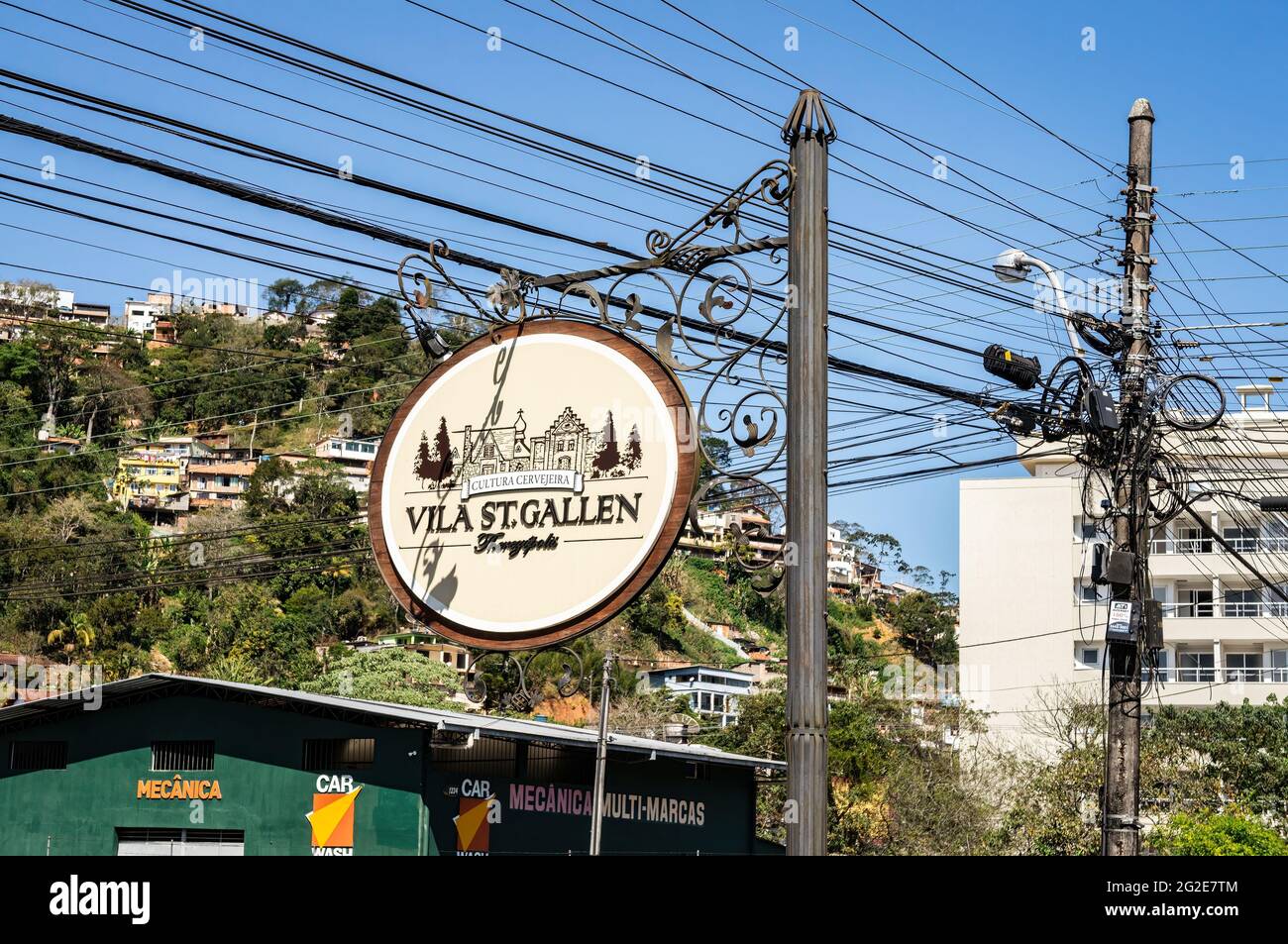 The St. Gallen village signboard hanging on a post with lots of wires behind at Alfredo Rebelo Filho street. Stock Photo