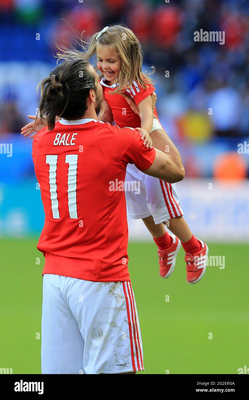 Gareth Bale of Wales with his young daughter after the game. Wales v Northern Ireland, UEFA Euro 2016 last 16 match at the Parc des Princes in Paris, Stock Photo
